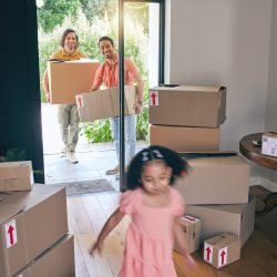 Gay father, moving and girl child running in new home with motion blur, playing or excited to start.